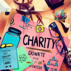 A charity poster on a table along with other accessories