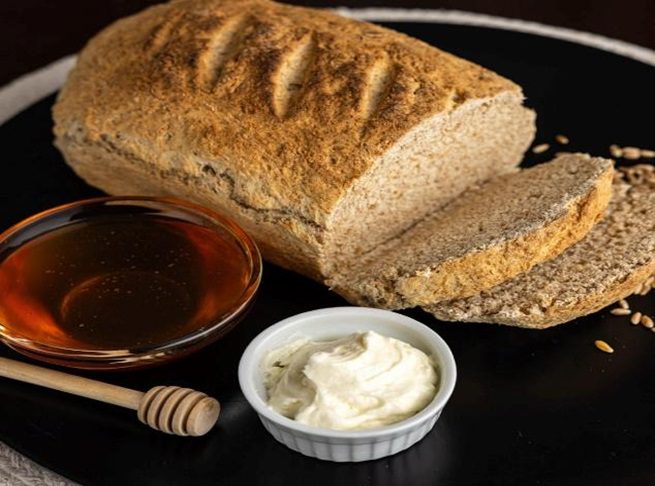 Freshly baked bread with honey and butter.